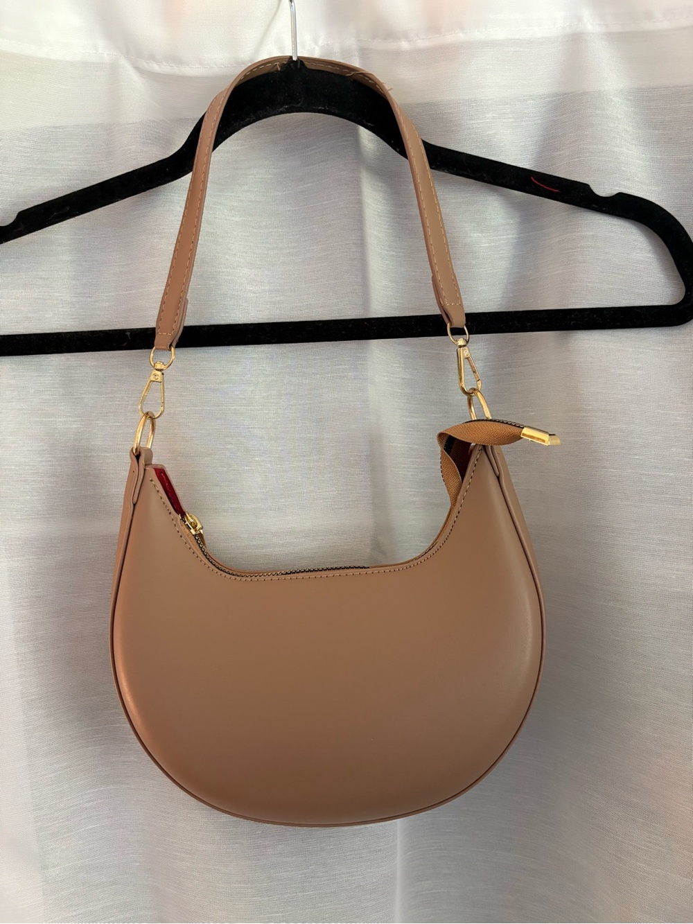 Tan faux leather purse with gold accents